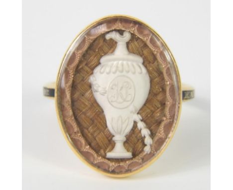 A George III memorial ring, the centre with cross over hair and white vase to centre bearing initials KB, surrounded by a ros