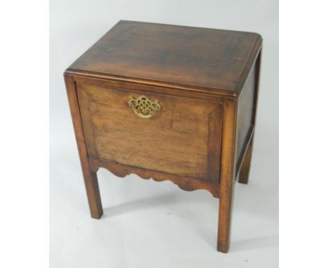 A George III and later mahogany commode, converted to a music system cabinet, with a drop down door, raised on chamfered, squ