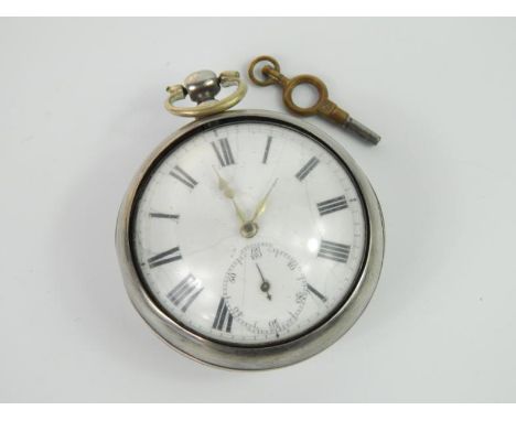 A George III silver pair cased pocket watch by Thomas Woodward, London, key wind, open faced white enamel dial bearing Roman 