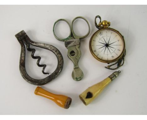 A Victorian steel folding corkscrew, scissor form cigar cutter, bone bottle form cutter, Carpenter & Westley pocket compass a