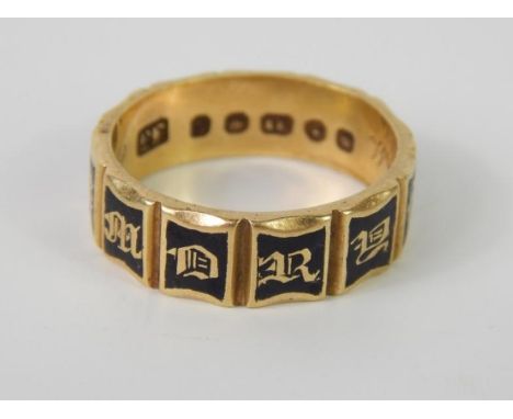 An 18ct gold memorial ring, with eleven sides in black enamel, each side with a letter in gold, 'memory of', internally engra