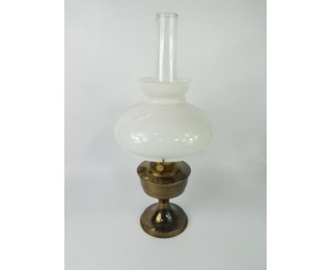 An Aladdin 23 brass oil lamp, with white glass shade, 60cm high.