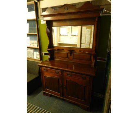 A Victorian mahogany mirror back sideboard, the shaped pediment over a rectangular bevelled glass mirror with shaped display 