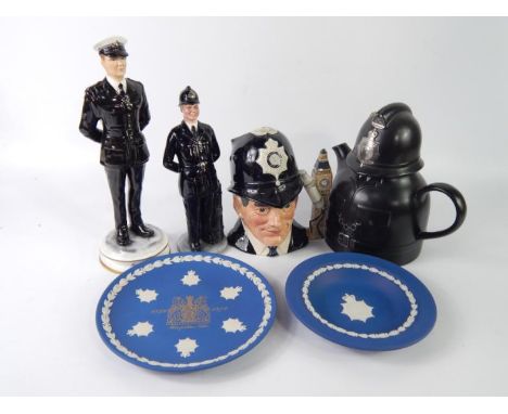 A Royal Doulton figure modelled as The Bobby HN2778, character jug The London Bobby D6744, Michael Sulty figure 'Traffic' lim