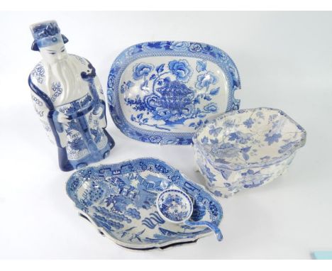 Early 19thC blue and white transfer printed pottery, including a sauce ladle decorated with a fence and garden, a pair of ser