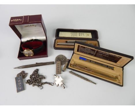 A Rotary gentleman's gold plated wristwatch, circular shaped dial, date aperture, cased, silver pencil, two pens, two silver 