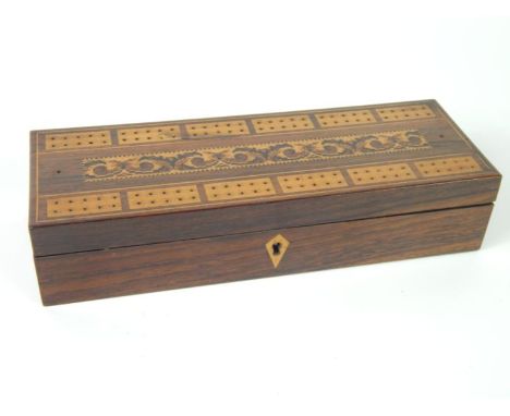 A Victorian rosewood and tunbridgeware playing cards box, with cribbage board top, containing cards and pegs, 26.5cm x 9cm x 