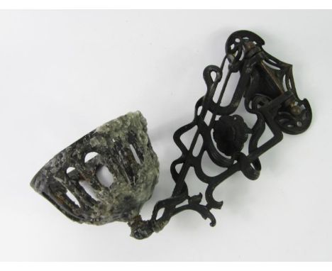 An Art Nouveau cast iron wall bracket oil lamp holder, with scrolling floral decoration, 35cm long.