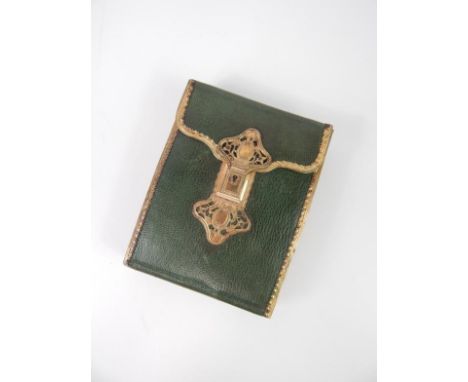 A Georgian green leather and gilt metal etui, with an ornate pierced rococo lock, pink fabric interior, containing a pair of 