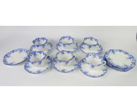 A Shelley porcelain part tea service decorated in the Dainty Blue pattern, comprising six cups, eight saucers and six tea pla