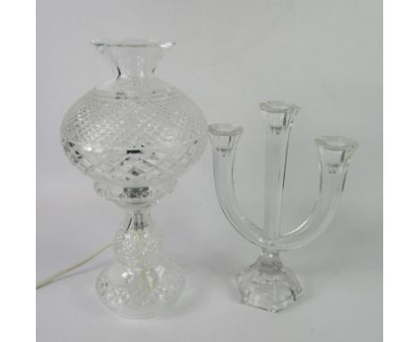 A cut glass table lamp and shade, 35.5cm high, and a Nachtmann cut glass three branch candelabra, 28cm high.