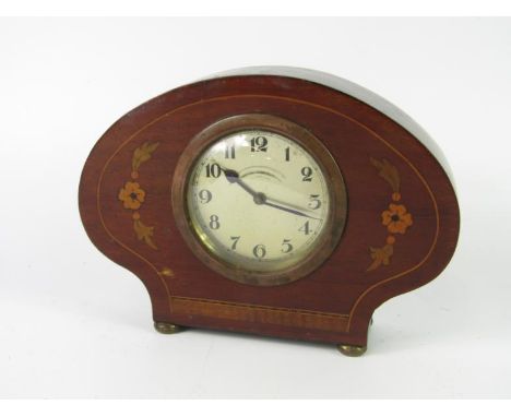 An Edwardian mahogany and floral inlaid mantel clock, dial bearing Arabic numerals, key wind movement, 19cm long.