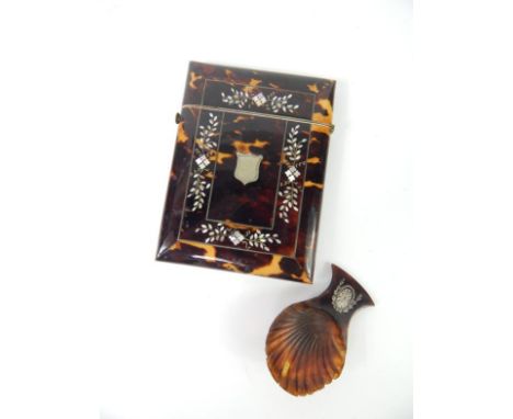 A Victorian tortoiseshell calling card case, with mother of pearl inlay, applied white metal shield, 10cm x 7.5cm, and a tort