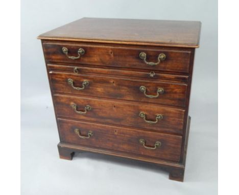 A George III mahogany bachelor's chest, of four long graduated drawers with brushing slide, raised on bracket feet, 85cm x 57