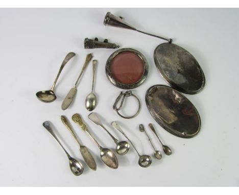 A Victorian silver hook and ring, Birmingham 1865, silver salt spoons, butter knives and a cream ladle, pair of silver hair b