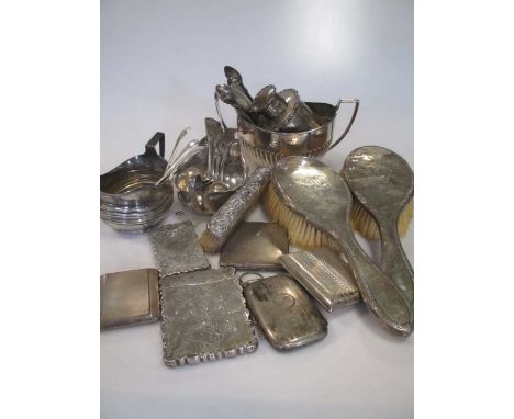 A quantity of silver and flatware, including a tea caddy, cream jug, sugar bowl, sauce boat, cigarette and card cases, teaspo