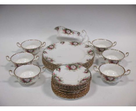 A Royal Albert dinner service, comprising of six plates, two serving dishes (One large one smaller), six side plates, six sou