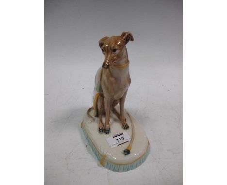 A majolica model of a seated greyhound, probably Minton, 19.5cm high