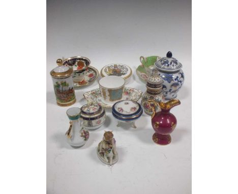 A collection of porcelain to include tea cups and saucers, a Shelley vase and floral encrusted miniature vases; a French faïe