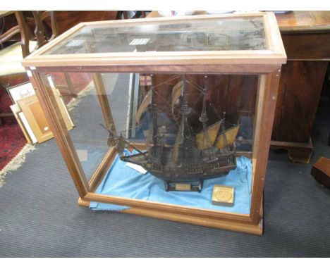 A cased model of a sailing ship, case measures 80 x 87 x 47cm
