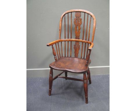 A 19th century elm and ash stick back Windsor elbow chair