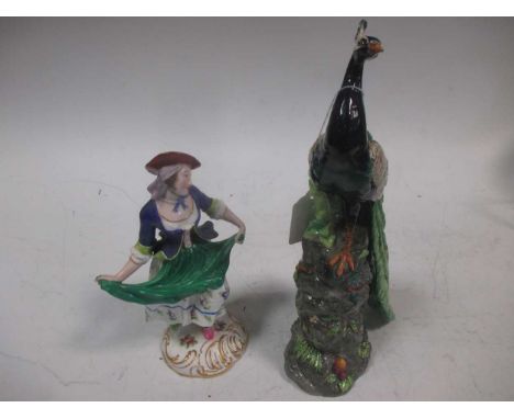 A Minton 'Minton in Miniature' model of a peacock, circa 2001, 26cm high; a Minton model of a girl, on a scroll moulded gilt 