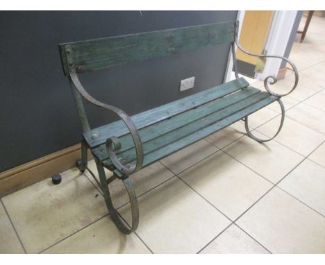 A green painted wood and metal slatted garden bench