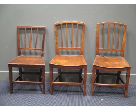 A pair of elm seated stick back chairs together with another chair (3)