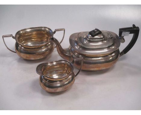 A three piece silver tea set, maker’s mark of The Barker Brothers, Birmingham, 1928 &amp; 1928, of boat form including: Teapo