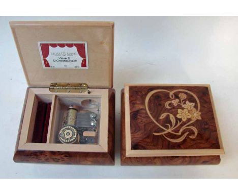 A 20th century Musical Ring Box by Reuge Music Sainte Croix Switzerland, hinged marquetry inlaid burr box containing a keywou