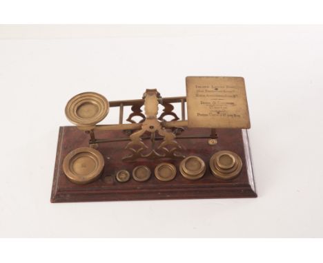 A set of S Mordan & Co postal scales, the brass scales on mahogany base, with inscription of use to one of the platforms, plu