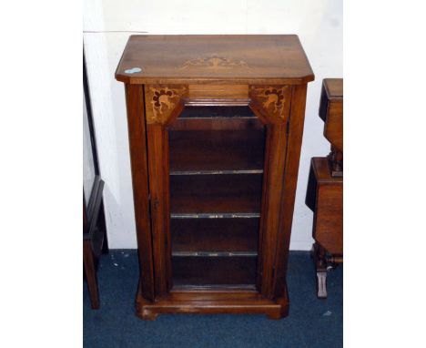 A Victorian walnut music cabinet, the marquetry cartouche to the top repeated on either side of the single glazed door, compl