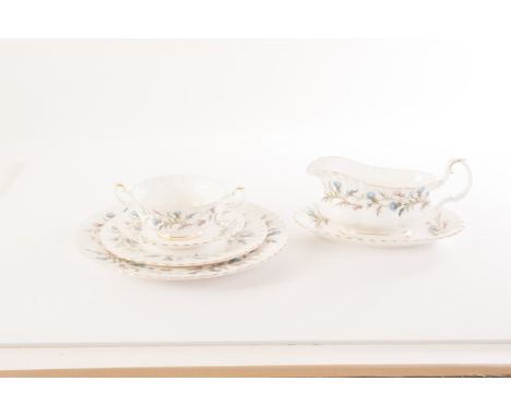 An extensive Royal Albert 'Brigadon' pattern dinner service, comprising soup bowls, cups and saucers, a three tier cake stand