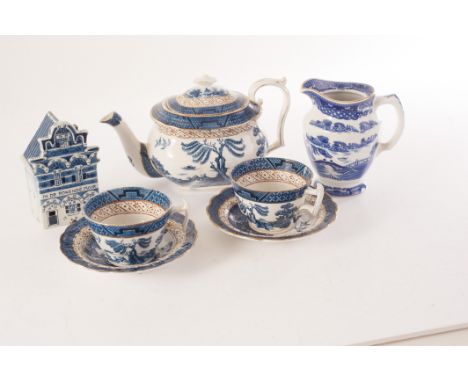 A large assortment of blue and white ceramics, including Booth's Real Old Willow pattern, Ringtons and more, comprising teapo