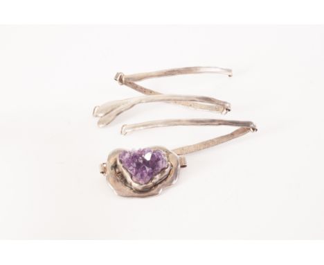 A Danish silver plated and amethyst belt, the large piece of rough amethyst mounted to centre, having five hinged silver plat