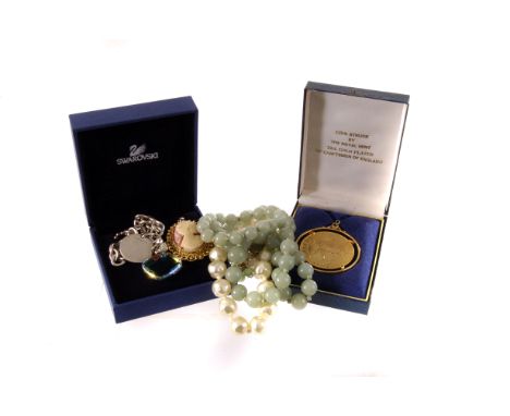 A small collection of jewels, including a Christian Dior necklace and earring, a green hardston string of beads and more (par