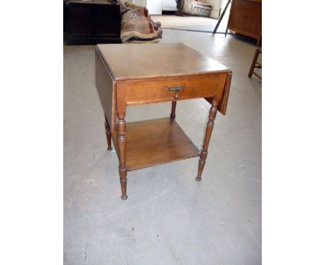 An Edwardian side table, with drawer to front and drop leaves, with lower shelf