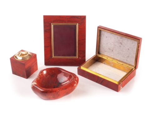 An Asprey of London red jasper companion set, comprising a cigarette box, table lighter, ashtray, and picture frame (4)