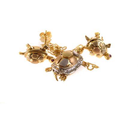 A 750 marked gold and mixed metal tortoise pendant, having ruby eyes and diamonds to shell, AF, on fine 9ct gold chain, toget