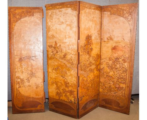 An Edwardian Art Nouveau four fold tooled leather dressing screen, decorated with a hunting scene of gentlemen in pursuit ove