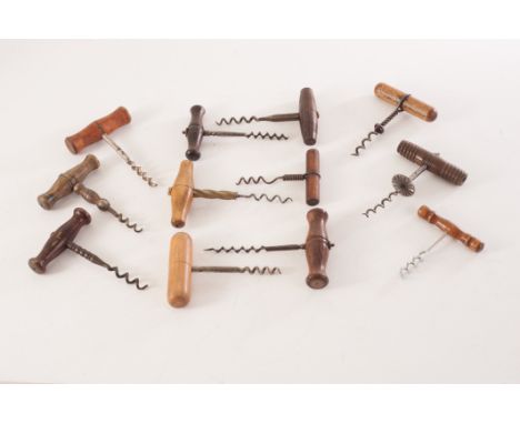 A group of antique and vintage pull corkscrews, all having turned wooden handles, some AF