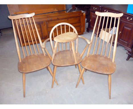 A pair of Ercol chairs, together with a single chair in the carver style, plus  reniform table (4)