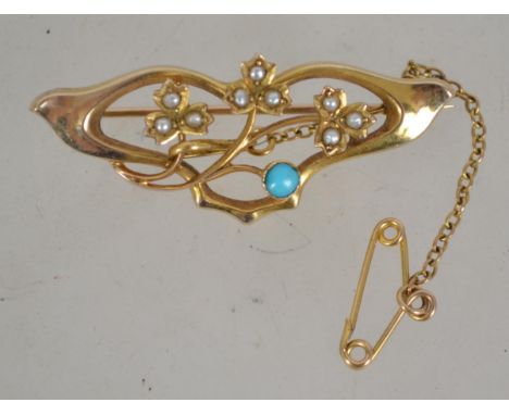 A 9ct gold vintage Art Nouveau ladies turquoise and seed pearl brooch with pin verso being marked 9ct . weight 2.8g