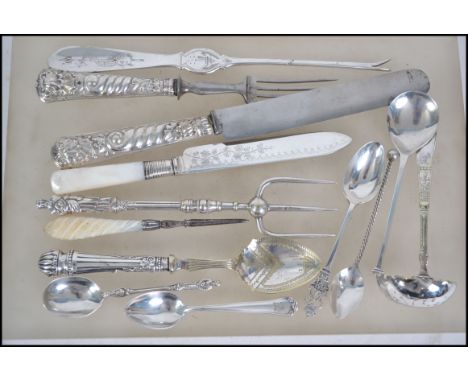 A group hallmarked silver, silver handled and silver plated wares to include spoons such as Sheffield 1925 by Harrison Bros, 