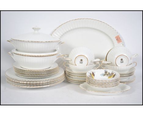 A vintage Paragon china soup and dinner service to include plates, side plates, soup bowls, tureens, serving tray etc.