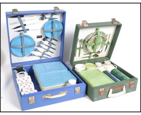 Two Brexton cased vintage picnic hampers, both with hinged cases opening to reveal an array of contents please see images.