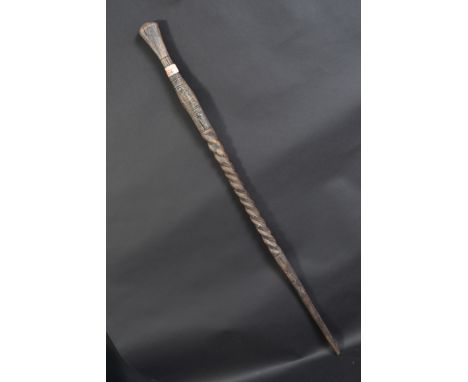 A 20th century ornate Polynesian walking stick, having carved and barley twist design.