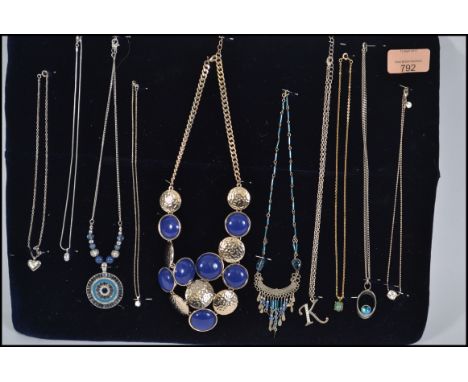 A group of 10 vintage silver and costume jewellery necklaces to include crystal drop pendants, heart pendants, festoon drops 