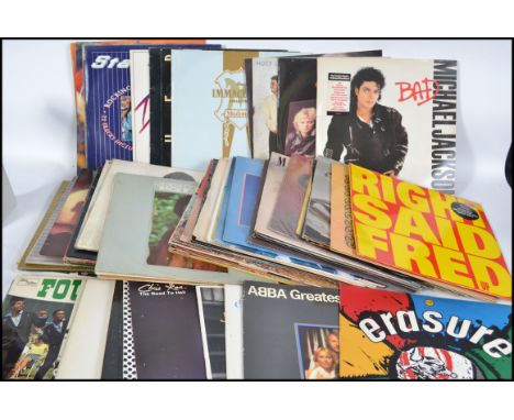 A collection of long play vinyl LP's dating from the 60's, 70's and 80's to include Right Said Fred, Queen, Michael Jackson, 