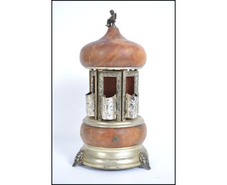 A vintage 1950's metamorphic musical cigarette dispenser by Rouge. The music being Torna A Surriento Santa Lucia. Measures 37